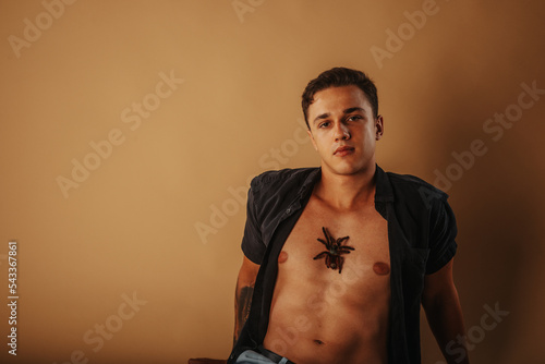 Man with tarantula on the chest
