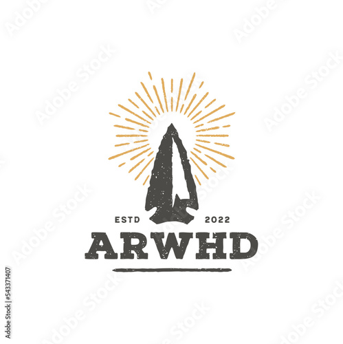 Rustic Arrow Spear Arrowhead with Sun Rays for Vintage Retro Summer Hunting logo design
