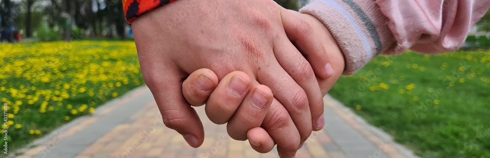 Boy and girl hold hands. Children friendship