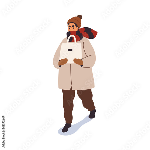 Person going outdoors in warm clothes, carrying shopping bag in winter. Man w...