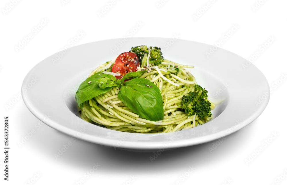 Italian pasta spaghetti with pesto sauce and basil leaf close-up Italian pasta spaghetti with pesto sauce and basil leaf close-up