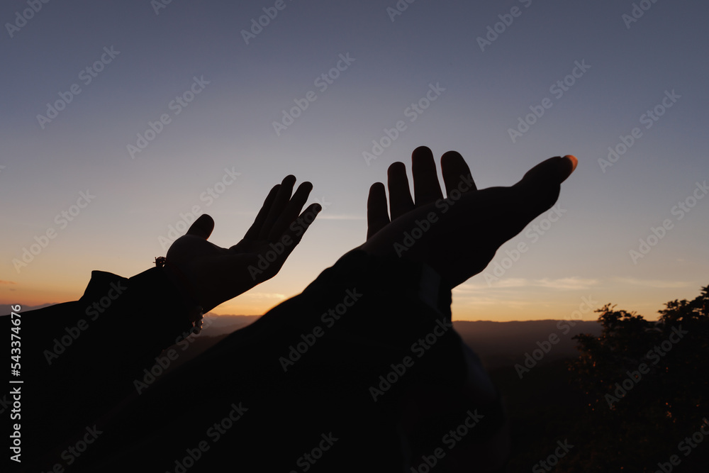 Silhouette of Human hands open palm up worship. Eucharist Therapy Bless God Helping Repent Catholic Easter Lent Mind Pray. Christian Religion concept background. fighting and victory for god.