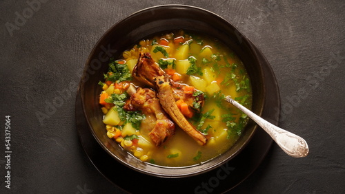 Pea soup with smoked pork ribs served in plate