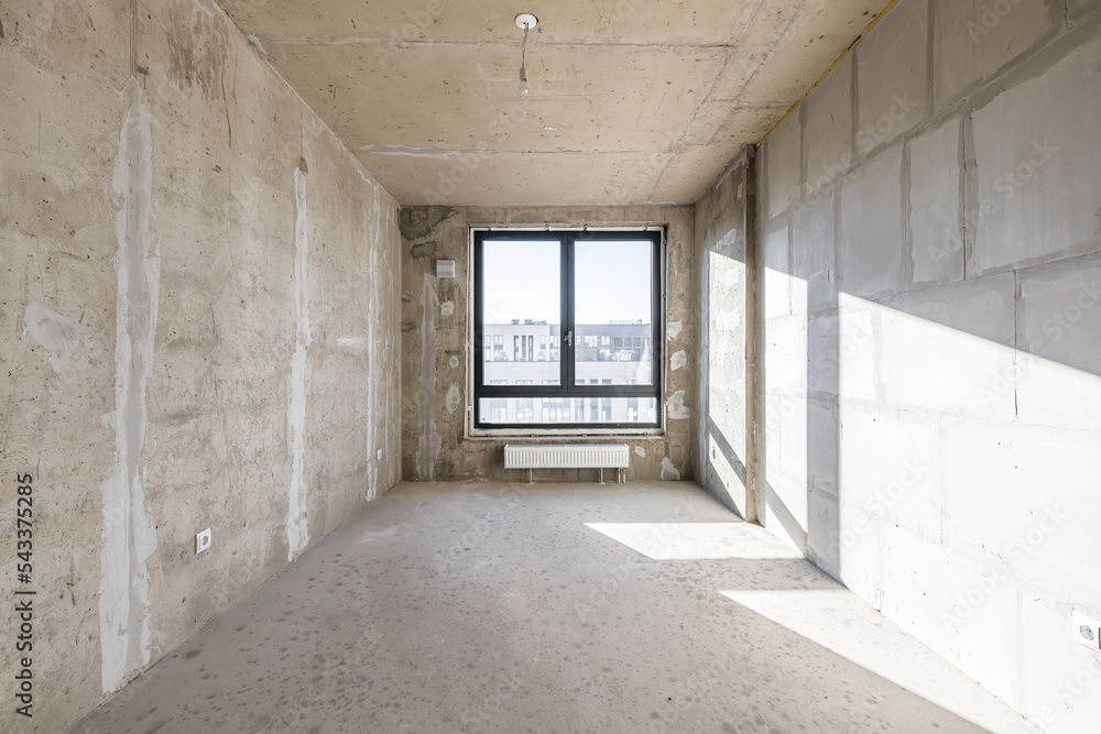 Empty concrete commercial space without finishing with partitions Empty concrete commercial space without finishing with partitions