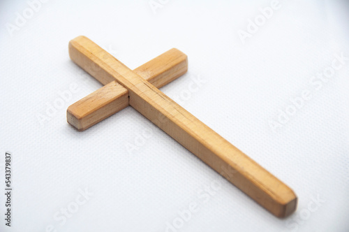Wooden Cross on white cover background representing Good Friday, Lent Season and Holy Week concept.