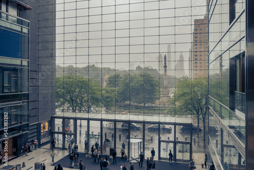 Looking out the window of shopping mall to Columbus Circle and Central Parl in New York City during rain photo