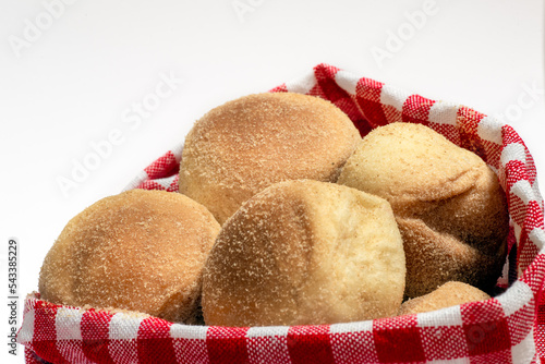 Pandesal or pan de sal is a Filipino traditional bread usually eaten during breakfast or afternoon snack. Isolated in white photo