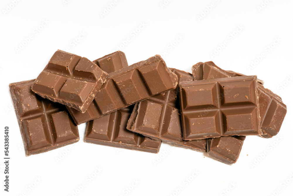 Crushed chocolate bars isolated in white. stacked. with copy space for texts