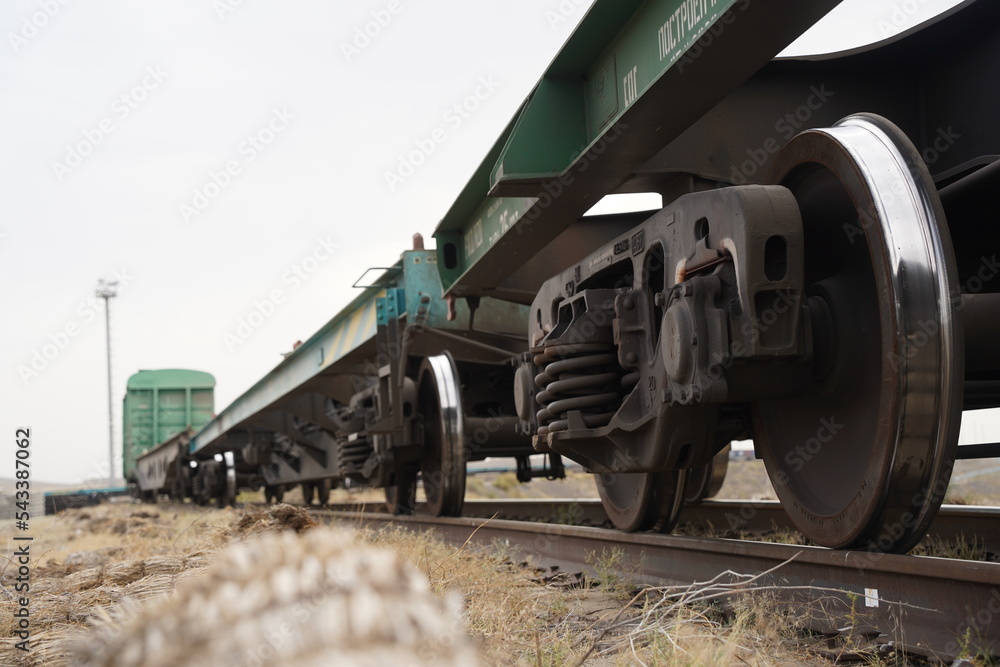 Khorgos, Kazakhstan - 09.22.2022 : Wheels of freight trains on the railway tracks. Khorgos Border Station. Khorgos, Kazakhstan - 09.22.2022 : Wheels of freight trains on the railway tracks. Khorgos Border Station.