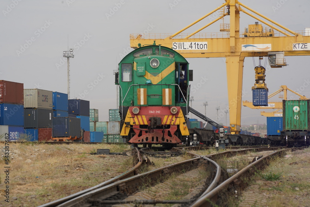Khorgos, Kazakhstan - 09.22.2022 : A freight locomotive on the railway tracks of the Khorgos border station. Khorgos, Kazakhstan - 09.22.2022 : A freight locomotive on the railway tracks of the Khorgos border station.
