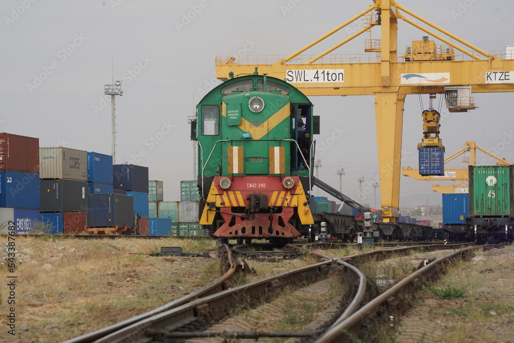 Khorgos, Kazakhstan - 09.22.2022 : A freight locomotive on the railway tracks of the Khorgos border station.