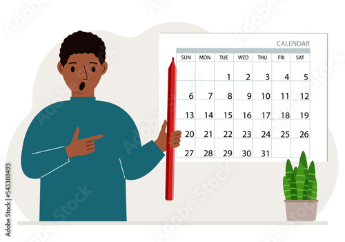 A man with a pencil in his hand creates a calendar. Planning and time management, responsible employee plans meetings and events.