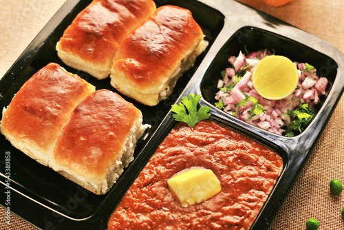 Pav bhaji is a fast food dish from India consisting of a thick vegetable curry served with bread. photo