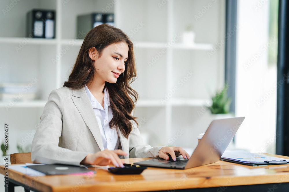 creative business woman using laptop and working in office creative business woman using laptop and working in office