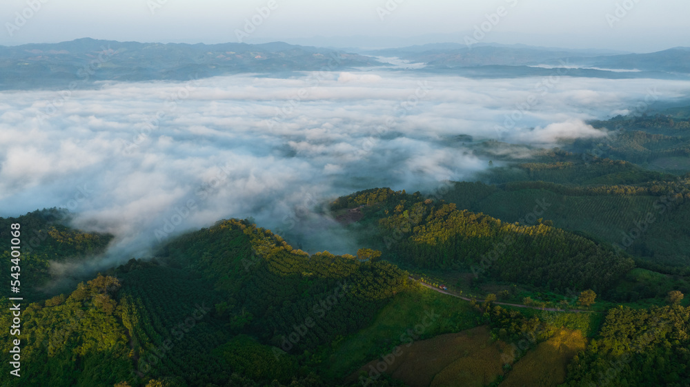 Morning mist heavy over reservoir national park, north of thailand aerial view