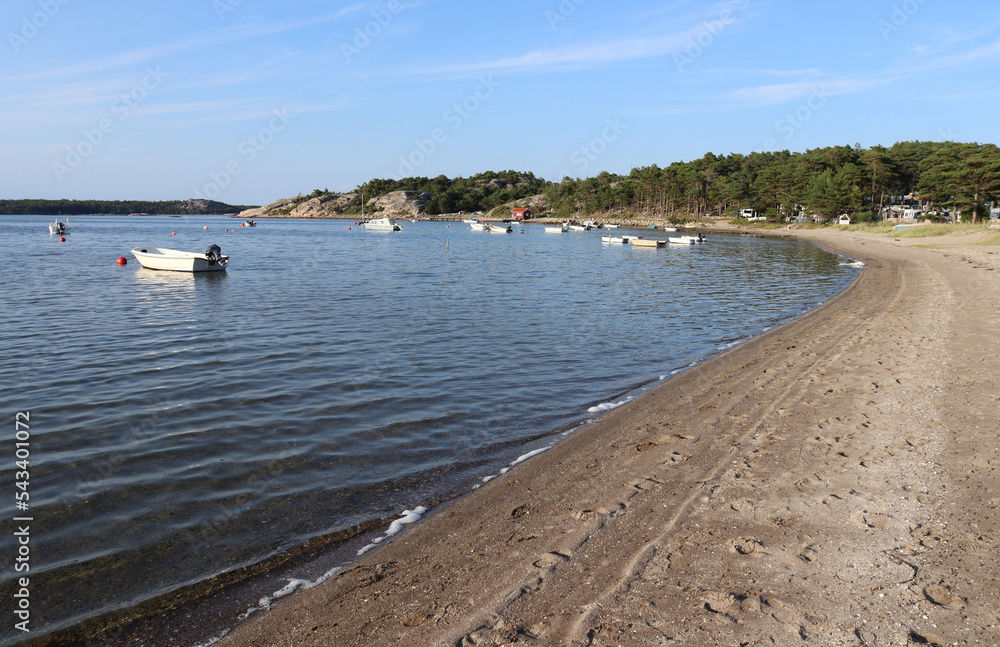 Summer evenings view of the beach and bay at Kyrkviken, on the beautiful island of Reso, on Sweden's idyllic West Coast. Bohulsan archipelago near Kosterhavet National Marine Park.