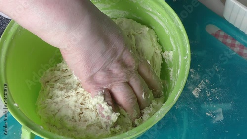 the cook kneads the dough for pies. healthy food concept
