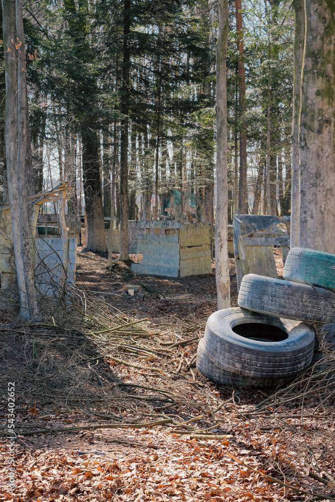 Arena for paintball sports. Fortification in the forest among walls made of wood and tires. Arena for paintball sports. Fortification in the forest among walls made of wood and tires.