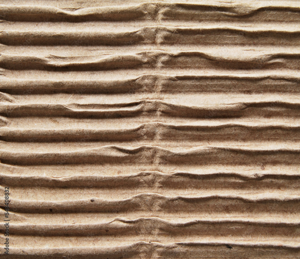 A sheet of brown corrugated cardboard texture as background
A sheet of brown corrugated cardboard texture as background