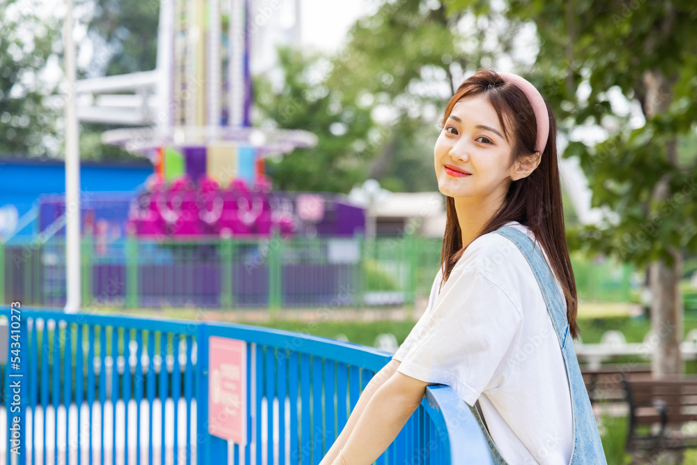 Asian girl at an amusement park