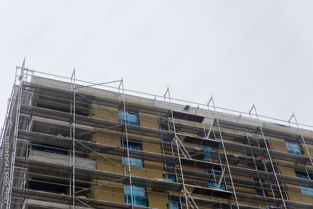Building apartment building. Placing rock wool insulation on the walls Building apartment building. Placing rock wool insulation on the walls
