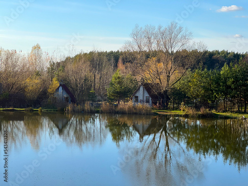 Autumn mood landscape with lake and forest in the perfect sunny weather