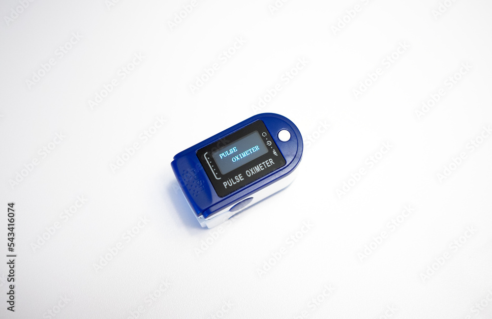 Portable pulse oximeter on a white background.A medical heart rate monitor. Compact device for measuring the air level in the lungs. Portable pulse oximeter on a white background.A medical heart rate monitor. Compact device for measuring the air level in the lungs.