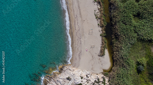 Aerial top view of Livadi Beach at the Ikaria island in a quiet summer day with blue clear water photo