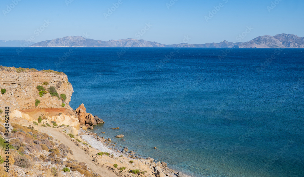 Turquoise clear blue water on a small beach in Ikaria, Greek Aegean Sea