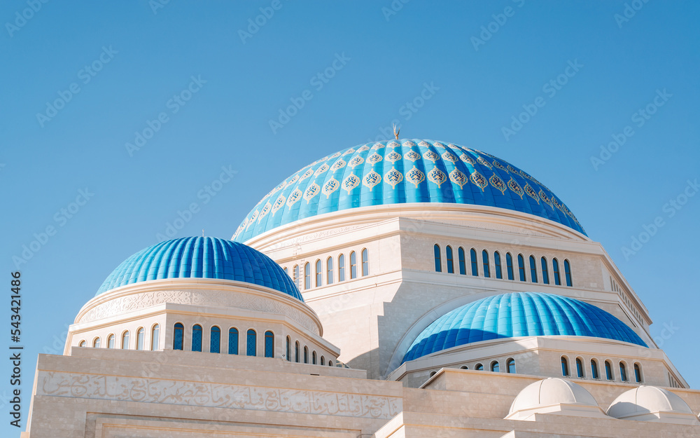 Beautiful mosque, blue dome with symbol of Islamic religion and faith, oriental architecture against clear blue sky on sunny day, exterior Beautiful mosque, blue dome with symbol of Islamic religion and faith, oriental architecture against clear blue sky on sunny day, exterior