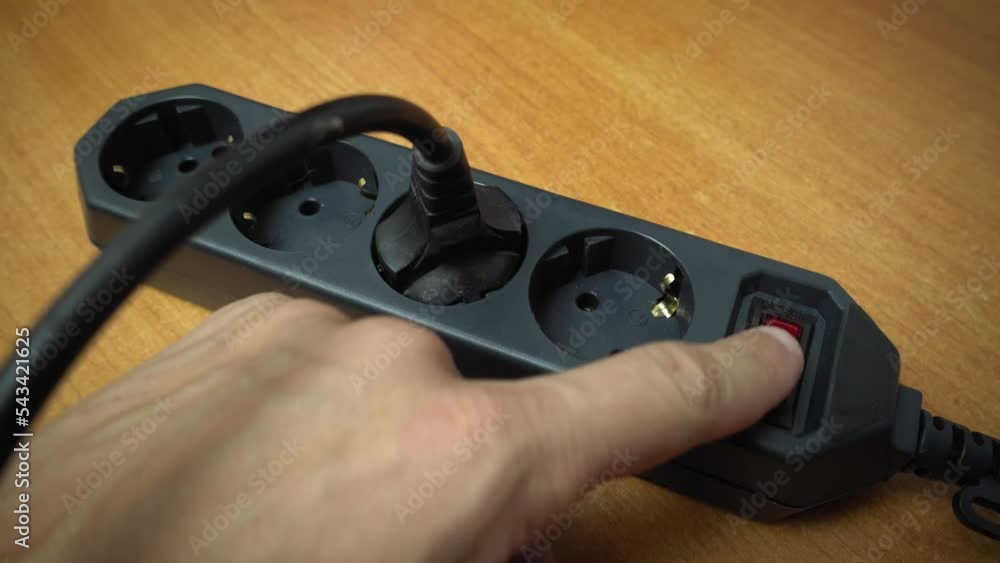 Insert plug into extension cord socket by pressing red push button ...