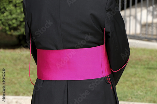 Rear portrait of a Catholic Bishop's cassock. Religion, catholic church photo