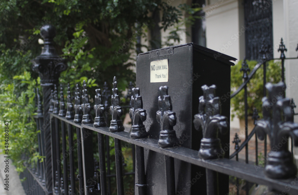 Letterbox and wrought iron fence outside terrace house Letterbox and wrought iron fence outside terrace house