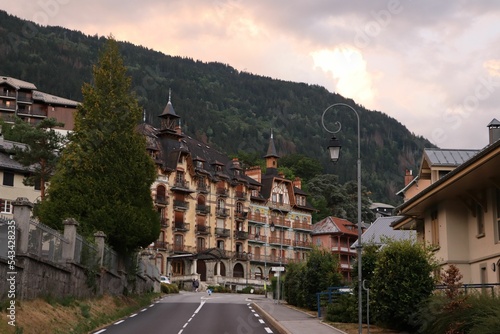 Beautiful shot of a road near historic buildings in Saint-Gervais-Les-Bains at sunset photo