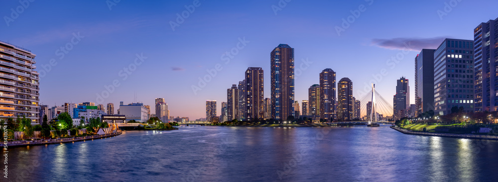 Fototapeta premium Panoramic view of Tokyo High rise condominium and Sumida river at magic hour.