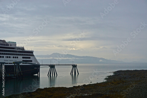 Hoonah, Alaska: Holland America cruise ship MS Amsterdam docked in Hoonah, Alaska, on a foggy morning with mountains in the background. photo