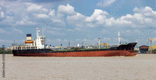 The Oil Products Tanker sails alongside the shore photo