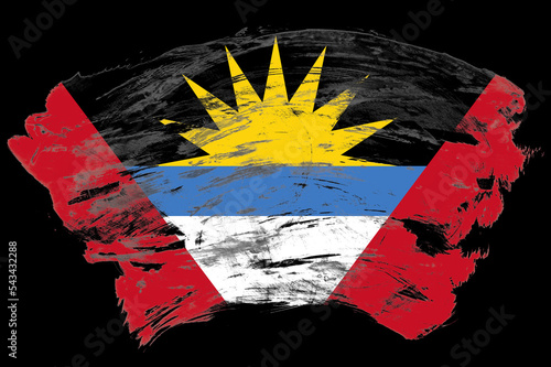 Antigua and barbuda flag on distressed black stroke brush background photo
