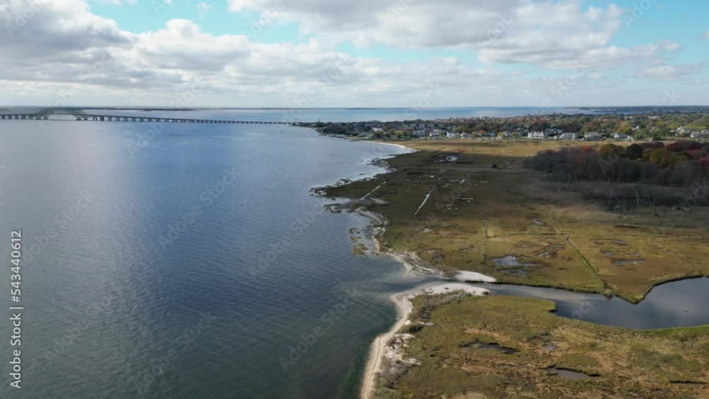 Drone view of long islands south shore looking over Gardiners Park in Bay Shore heading toward the Great South Bay bridges in West Islip New York. Drone view of long islands south shore looking over Gardiners Park in Bay Shore heading toward the Great South Bay bridges in West Islip New York.