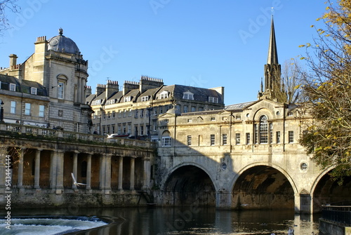 Pulteney Bridge surrounded by Georgian Architecture, over the River Avon, in Bath, England photo