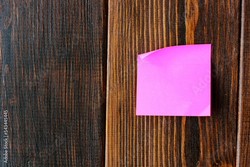 purple sticker on a wooden ...