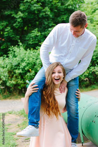Happy couple - girl with bo...