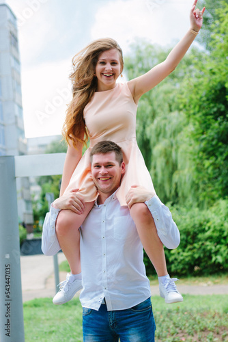 Happy couple - girl with bo...