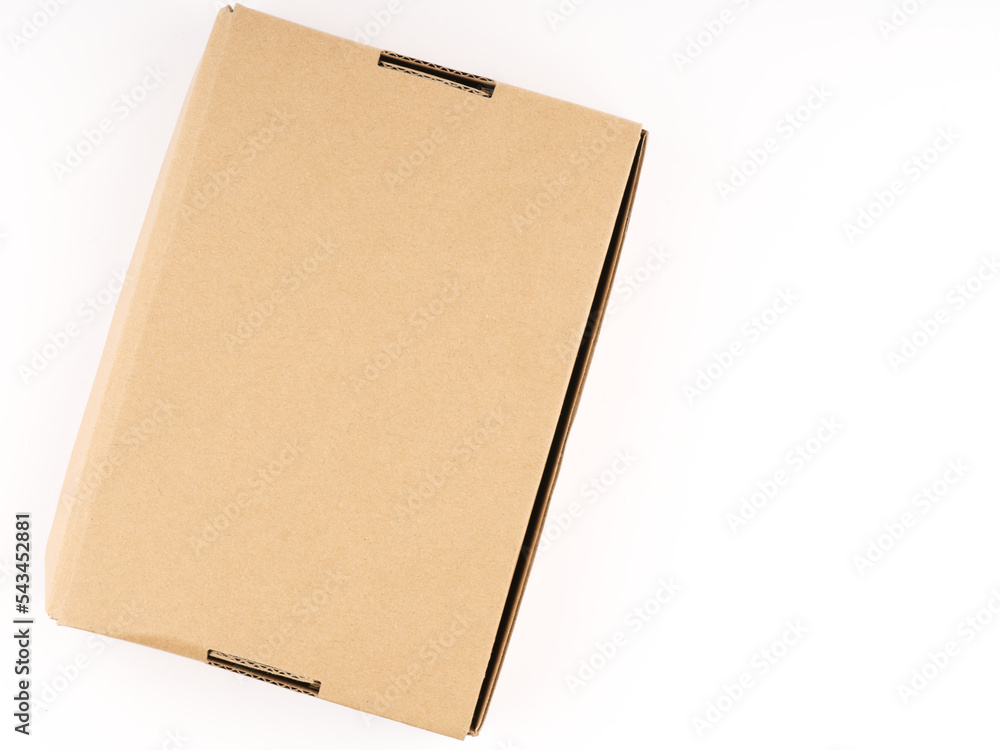 Closed cardboard box on a white background. View from above. Place for text Closed cardboard box on a white background. View from above. Place for text