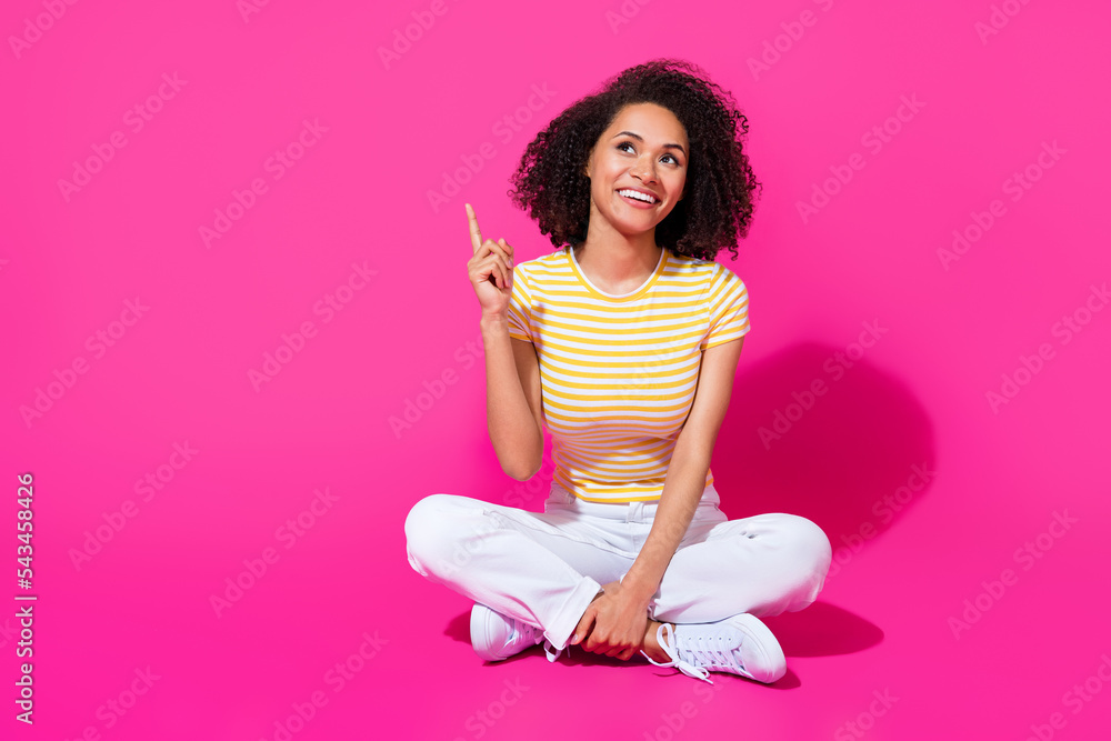 Full length photo of young attractive cute woman finger pointintg empty space dreamy advert shopping isolated on pink color background Full length photo of young attractive cute woman finger pointintg empty space dreamy advert shopping isolated on pink color background