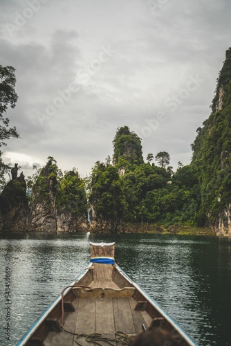 Vertical shot of scenic sandstone rocks from the boat in Cheow Lan lake in Khao Sok National Park