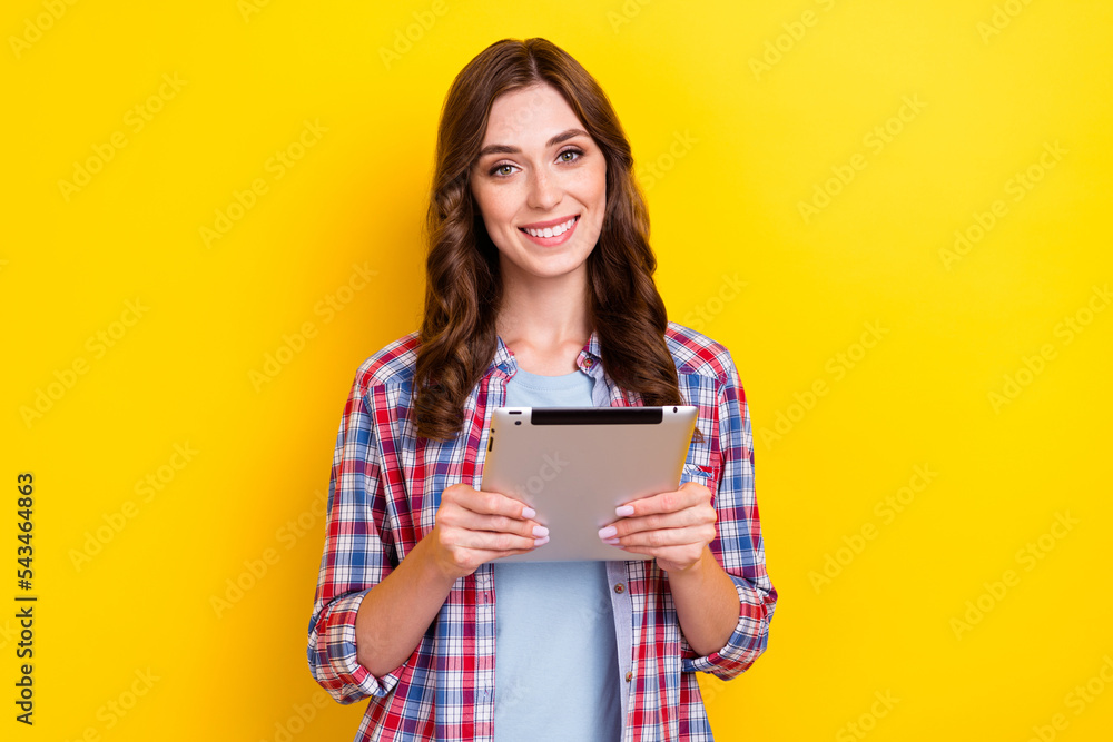 Closeup photo of assistant business lady hold her favorite apple ipad pro using tablet for work comfort gadget isolated on yellow color background Closeup photo of assistant business lady hold her favorite apple ipad pro using tablet for work comfort gadget isolated on yellow color background