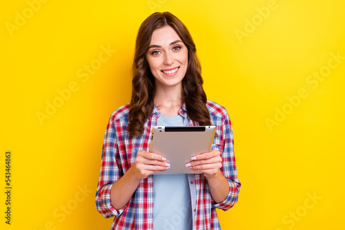 Closeup photo of assistant business lady hold her favorite apple ipad pro using tablet for work comfort gadget isolated on yellow color background