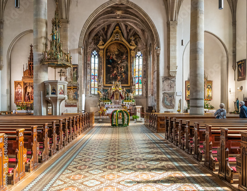Interior of the majestic St. Cyricus and Julitta Church. Gothic church of the Termeno.village (Tramin) in South Tyrol Trentino Alto Adige – Italy - October 31, 2022