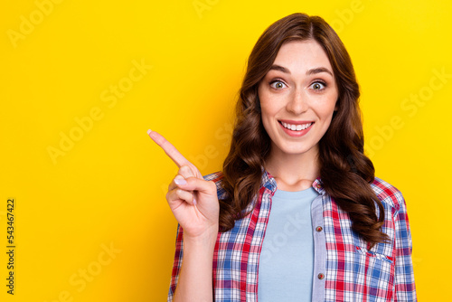 Fotografija Photo of pretty impressed girl dressed checkered shirt pointing finger empty spa